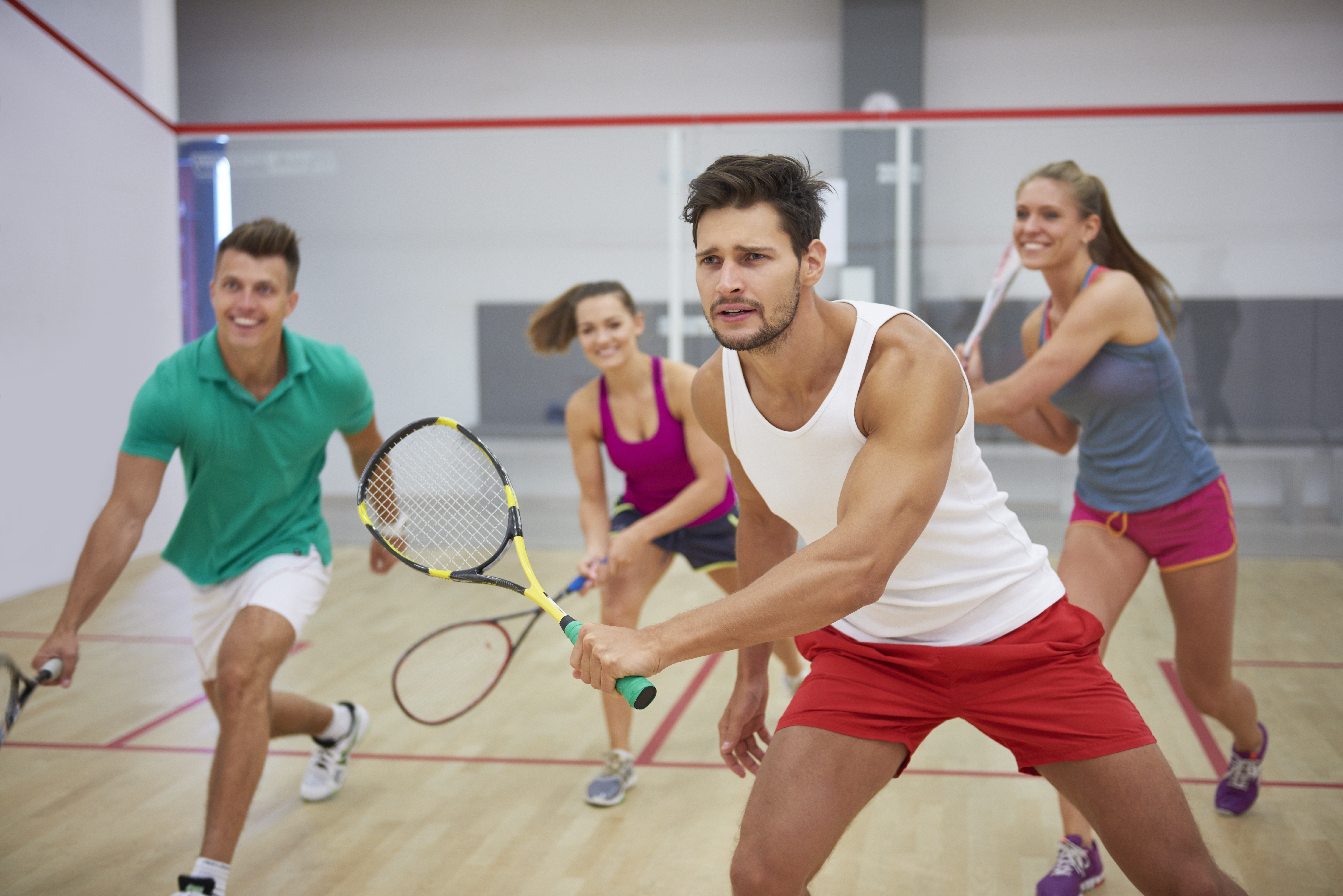 <a href="https://www.freepik.com/free-photo/active-young-people-playing-squash_12930643.htm#from_view=detail_alsolike">Image by gpointstudio</a> on Freepik